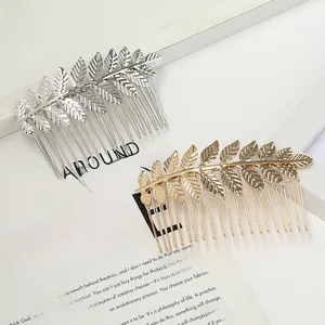 Close-up of gold and silver alloy leaf hair combs with elegant hollowed-out metal design