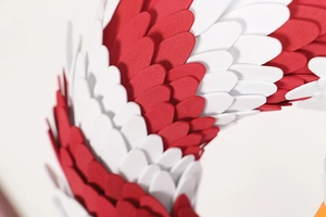 Macro shot of layered red and white foam feathers on an American eagle wreath