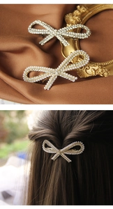 Detail of rhinestone bow hair clips in silver and gold finishes with pearl accents