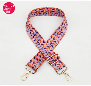 Close-up of No. 101 colorful floral handbag strap with light gold hardware clasps