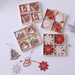 Wooden Christmas tree ornaments set with reindeer and snowflakes in a storage box