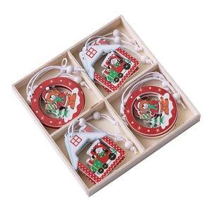 3D wooden Christmas tree ornaments set with star, bear, and snowman motifs in a display box