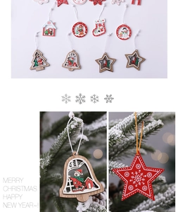 Detailed view of wooden Christmas ornaments hanging on snowy pine branches in holiday scene