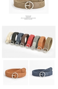 Close-up of woven braided belts in multiple colors with round metal buckles and leather tips