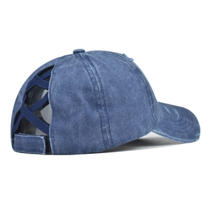 Close-up of washed blue denim ponytail baseball cap with elastic criss-cross back detail