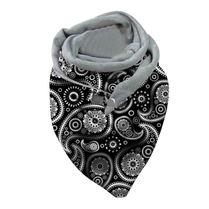 Detail of paisley print neck warmer with gray fleece lining and secure button closure