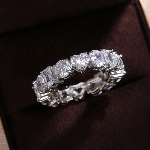 Macro detail of rectangle and heart shaped cubic zirconia stones on eternity ring
