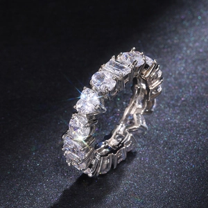 Detailed macro shot of eternity ring with various mixed cut clear cubic zirconia stones