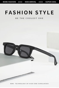 Detail view of square black thick frame sunglasses with dark gray lenses on minimal props