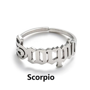 Detailed close-up of adjustable silver Scorpio zodiac ring with hollow letter design