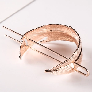 Elegant rose gold metal feather hair pin with dual prongs for buns and updos