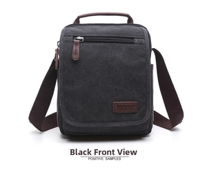 Detailed front view of black canvas crossbody bag with zips and leather brand tag
