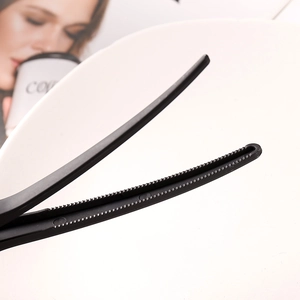 Macro shot of black plastic hair claw clip showing inner teeth for strong grip