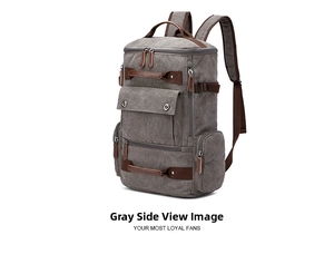 Detailed side view of a grey canvas backpack with brown leather accents and multiple zippers