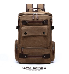 Front view of coffee brown canvas backpack with leather zipper pulls and multiple pockets