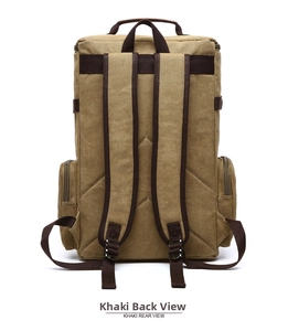 Rear view of khaki canvas backpack showing wide shoulder straps and durable metal zippers