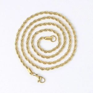 Detail of 3mm gold stainless steel twist chain necklace with lobster clasp and texture