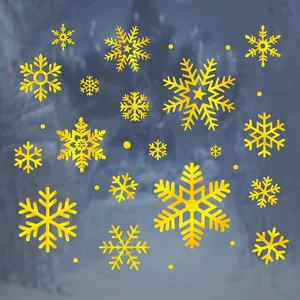 Golden Christmas snowflake window stickers with intricate cutout patterns for festive decor