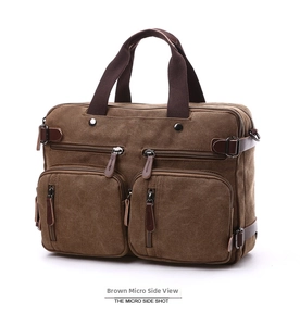 Side view detail of a coffee canvas briefcase showing pockets and metal fasteners