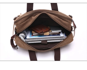 Internal view of the large canvas messenger bag showing capacity for tablets and books
