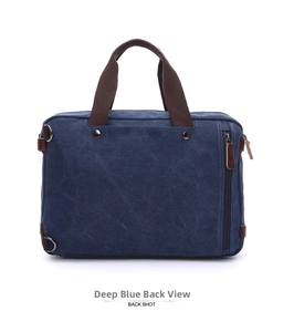 Detail view of the back of a dark blue canvas briefcase with vertical zipper pocket