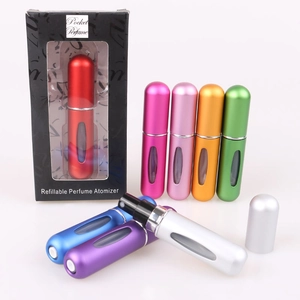 Collection of vibrant multicolored 5ml refillable metal perfume atomizers in a neat row