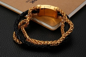 Macro detail of men's leather braided bracelet with gold stainless steel magnetic buckle