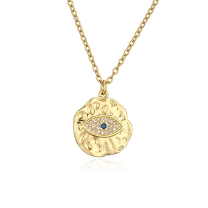 Macro shot of gold-plated evil eye pendant necklace with micro-pave blue cubic zirconia