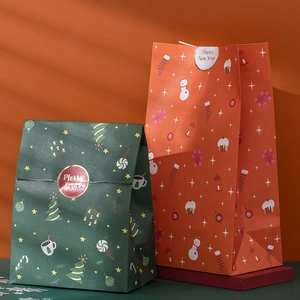Christmas paper gift bags with holiday prints and stickers in green and red colors