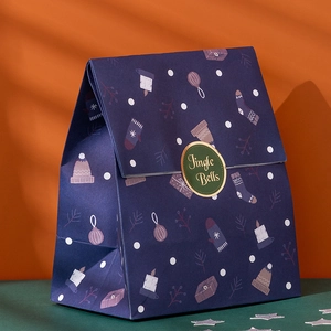 Navy blue Christmas gift bag with Jingle Bells seal and festive holiday patterns