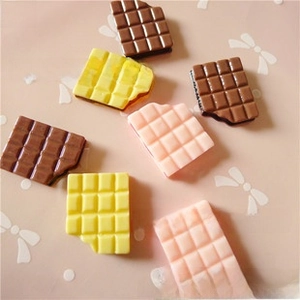 Detailed macro view of mini resin chocolate charms for DIY crafts and phone cases