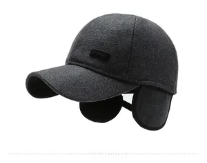 Detail view of the warm earflaps and thick wool felt texture on this winter baseball cap