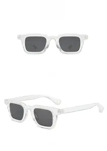 Detail view of square transparent frame sunglasses with dark grey lenses in front and side views