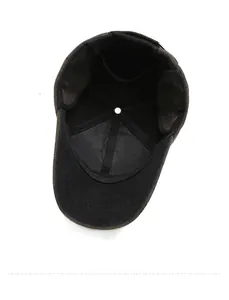 Detail view of the warm inner lining and foldable ear flaps of the winter baseball cap