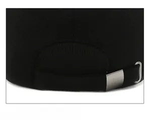Detail of adjustable metal buckle and thick fabric texture on men's winter baseball cap