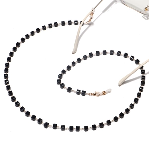 Handmade gold eyewear chain featuring black square crystal beads and non-slip rubber loops