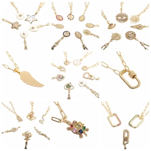 Collection of gold necklaces with angel, star, heart, and zircon pendants set on white background
