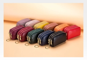 Detail of multi-layered genuine leather coin purses in eleven vibrant colors with gold zippers