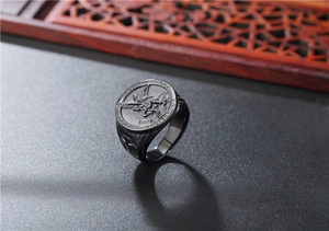 Detailed engraving of Saint Michael on black stainless steel ring with relief finish