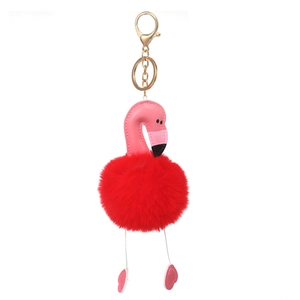 Pink flamingo keychain with red plush pompom and golden metal clasp for handbag decor