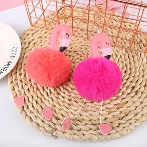 Pink and rose red flamingo pom pom keychains with plush body and PU leather details