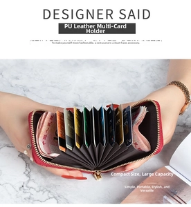 Macro view of red PU leather card wallet showing multi-slot accordion interior and zipper
