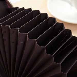 Detailed interior of dark brown accordion card holder with multiple functional slots