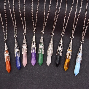 Collection of nine hexagonal crystal pillar necklaces with silver hollow metal caps