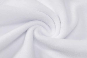 Close-up of soft white fleece fabric texture showing plush material and thickness