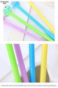 Close-up of cute cartoon dinosaur gel pens in four pastel colors on a notebook