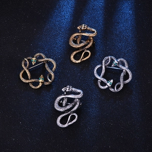 Vintage snake brooch set in gold and silver finish with crystal eyes for suits