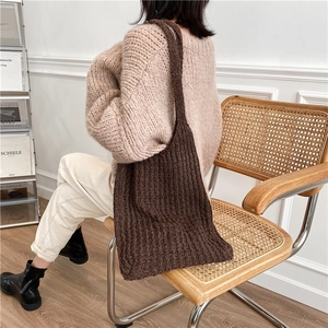 Large woven knit tote bag in dark brown color with spacious minimalist shoulder design