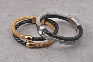 Macro shot of double-layer leather braid and steel mesh bracelet with magnetic clasp