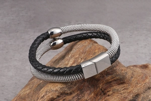 Detail of double-layer woven leather and metal mesh bracelet with magnetic steel clasp